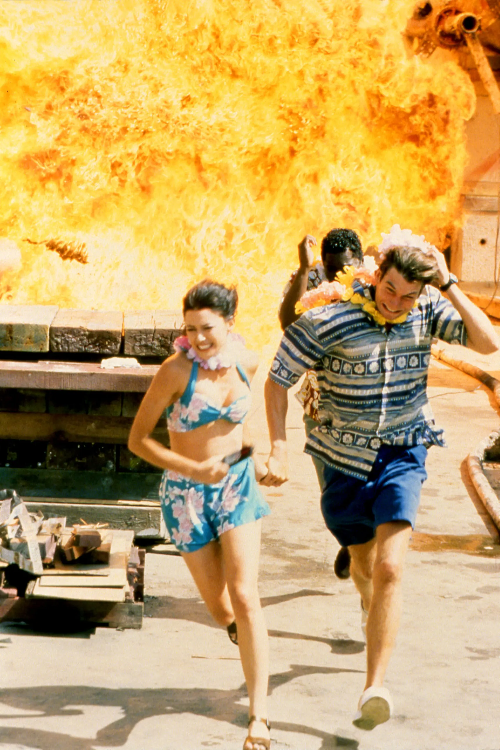 Behind the scene photo of the Sliders trio running from an explosion in the episode Common Ground