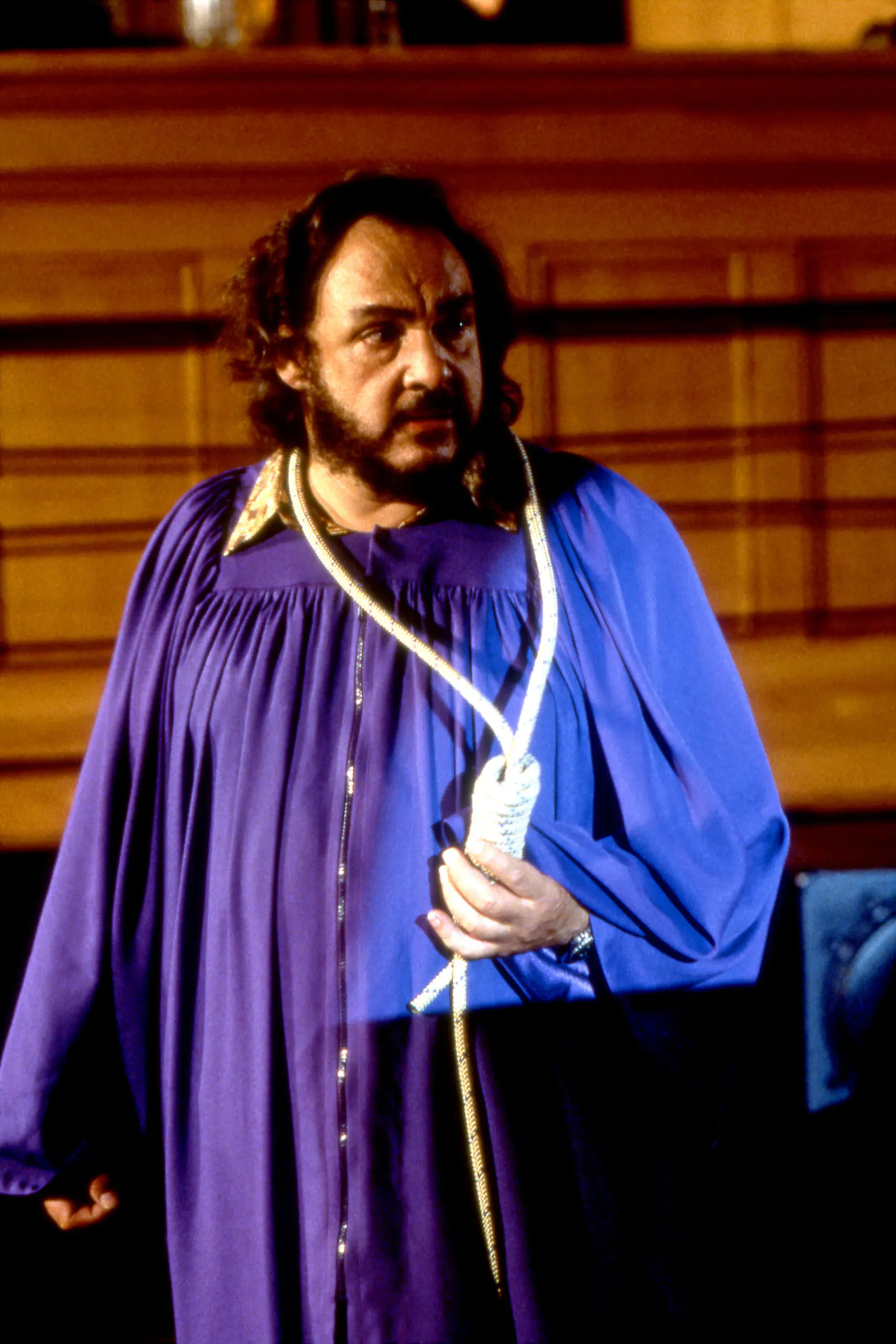 Professor Arturo with a rope around his neck from the episode Dead Man Sliding