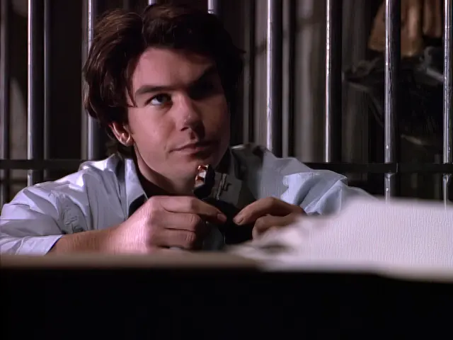 Quinn Mallory holds the timer inside a jail cell in the Sliders episode As Time Goes By