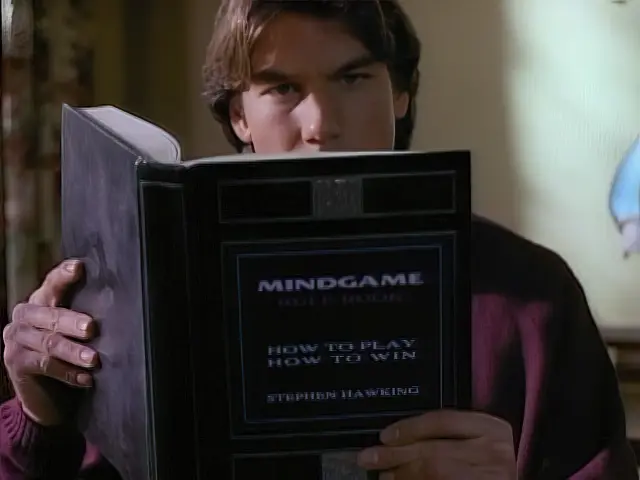 Quinn Mallory reads a book on the rules of Mindgame by Stephen Hawking in the Sliders episode Eggheads
