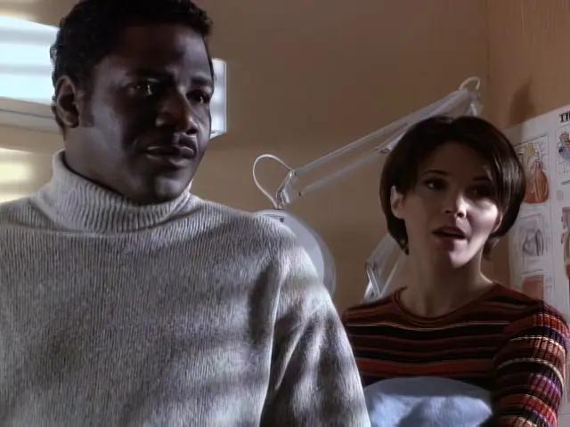 Cleavant Derricks and Sabrina Lloyd standing in a hospital patient room in the Sliders episode Obsession